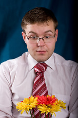 Image showing Shocked man with flowers