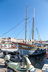 Image showing SAINT TROPEZ, FRANCE -  SEPTEMBER 16, 2008: View of Saint Tropez harbor with yachts and bikes . concept of modern modes of transport rich people