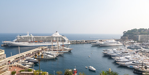 Image showing MONTE CARLO, MONACO -  SEPTEMBER 20, 2008: View on Port Hercules with luxurious yachts and a cruise ship REGENT in Monte Carlo, Monaco.