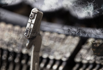 Image showing J hammer - old manual typewriter - mystery smoke