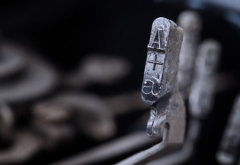 Image showing A hammer - old manual typewriter - cold blue filter