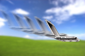 Image showing Laptop flying