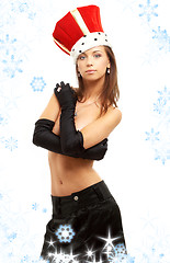 Image showing girl in black gloves and red crown with snowflakes