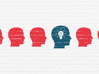 Image showing Finance concept: head with light bulb icon on wall background