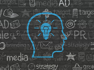 Image showing Advertising concept: Head With Lightbulb on wall background