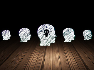 Image showing Business concept: head with light bulb icon in grunge dark room