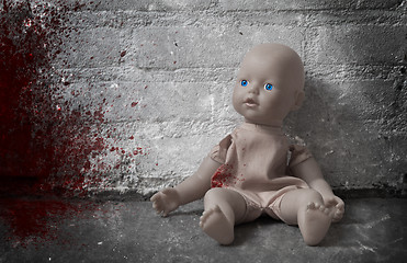 Image showing Concept of child abuse - Bloody doll