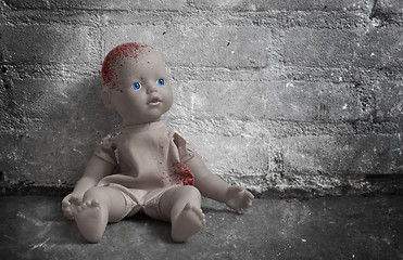 Image showing Concept of child abuse - Bloody doll