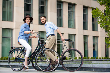 Image showing Romantic date of young couple on bicycles