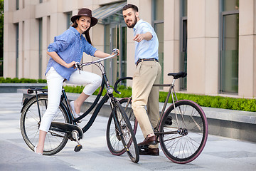 Image showing Romantic date of young couple on bicycles