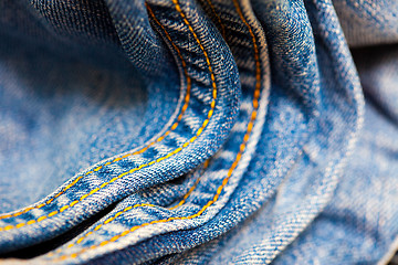 Image showing old Jeans with yellow stitching thread