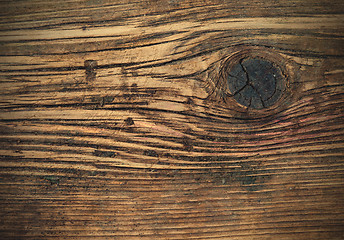 Image showing aged wooden boards with a knot
