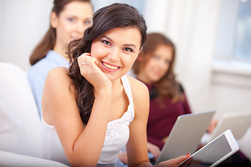 Image showing smiling young girl with tablet