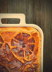 Image showing pie in a white ceramic pot on vintage boards