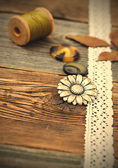 Image showing vintage buttons with lace tape