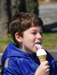 Image showing Boy licking ice cream