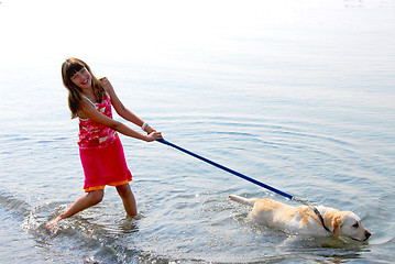 Image showing Girl playing dog