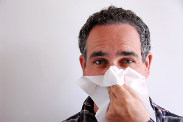 Image showing Sick man blowing nose
