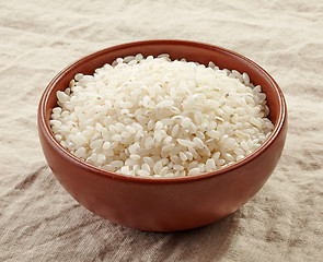 Image showing bowl of raw round rice