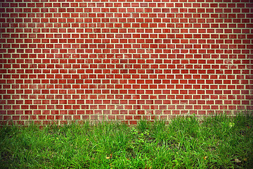Image showing Brick wall and green grass background