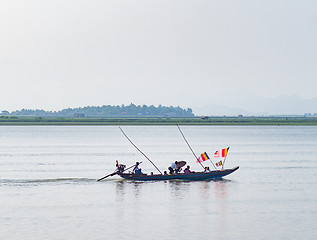 Image showing Boat with Buddhist flags in Myanmar