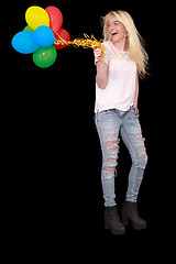 Image showing Portrait of a happy young woman with a bundle of balloons