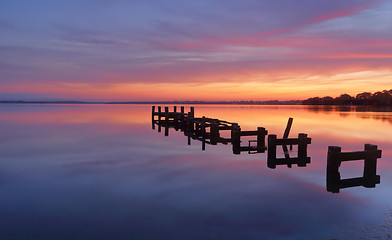 Image showing Serene water and stunning sunrise at Gorokan Jetty Australia