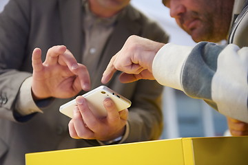 Image showing business man working on phone at office