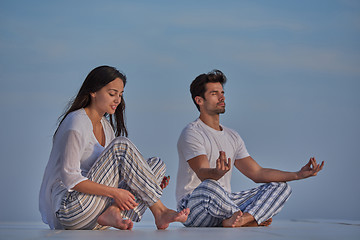 Image showing young couple practicing yoga