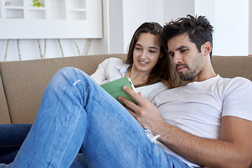 Image showing couple at modern home using tablet computer