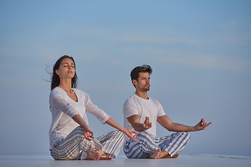 Image showing young couple practicing yoga