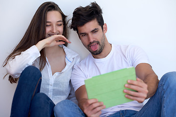 Image showing couple at modern home using tablet computer