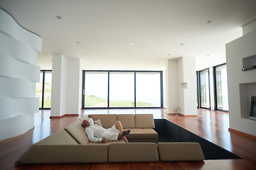 Image showing Portrait of senior man relaxing in sofa