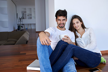 Image showing relaxed young couple at home staircase