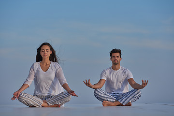 Image showing young couple practicing yoga