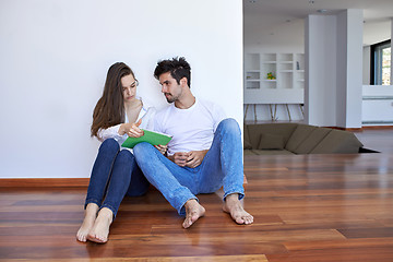 Image showing couple at modern home using tablet computer