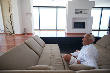 Image showing Portrait of senior man relaxing in sofa