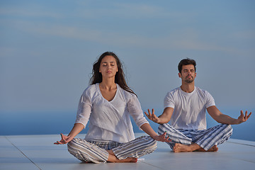 Image showing young couple practicing yoga