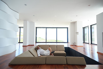 Image showing Portrait of senior man relaxing in sofa