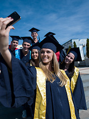 Image showing students group in graduates making selfie