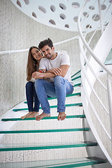 Image showing relaxed yung couple at home  stairs