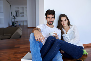 Image showing relaxed young couple at home staircase