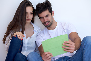 Image showing couple at modern home using tablet computer