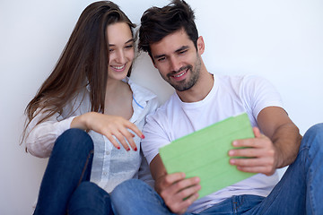 Image showing couple at modern home using tablet computer