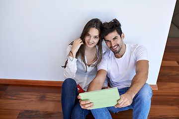 Image showing couple at modern home using tablet computer