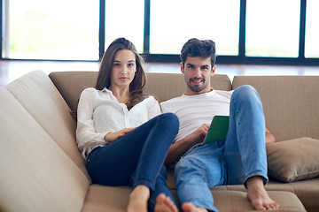 Image showing couple at modern home using tablet computer