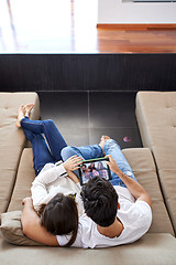 Image showing couple at modern home using tablet computer