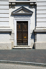 Image showing old castronno   in  italy   the old  wall  and church door  