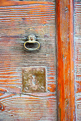 Image showing  varese abstract  rusty brass brown knocker in a    