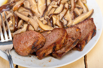 Image showing venison deer game filet and wild mushrooms